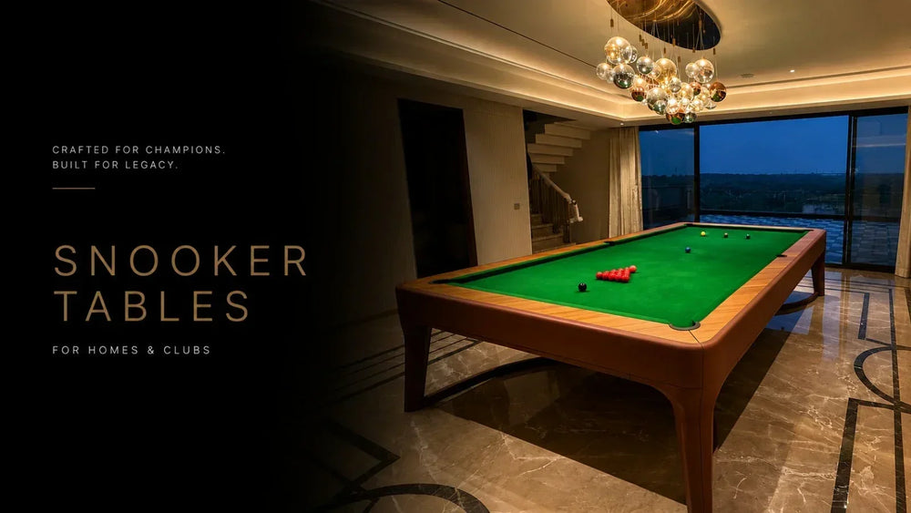 ARGMAC snooker table with wooden rails and legs, snooker balls racked on green cloth, set in a marble-floored room with floor-to-ceiling windows at dusk.