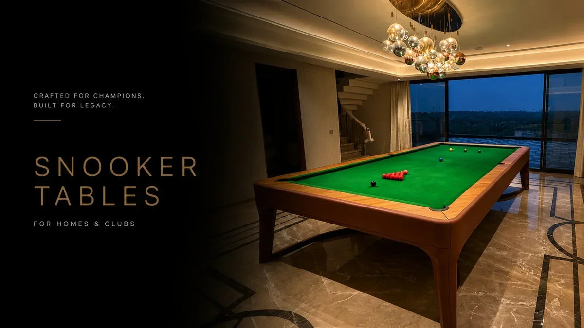 ARGMAC snooker table with wooden rails and legs, snooker balls racked on green cloth, set in a marble-floored room with floor-to-ceiling windows at dusk.